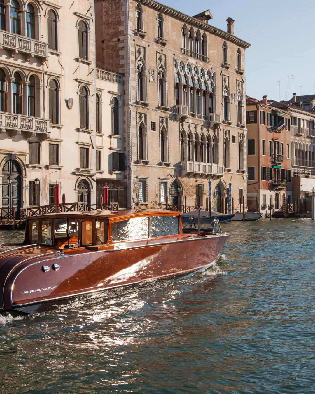 image  1 Aman Venice - The Aman boat glides along the Grand Canal, past historic buildings that have watched