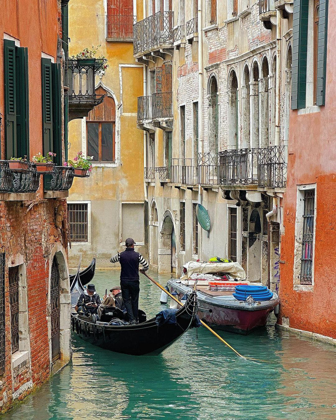 Drift between the pastel-coloured buildings that line Venice’s waterways on a gondola
